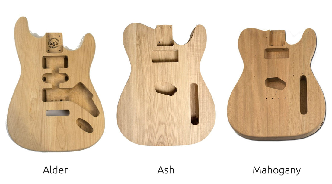 Alder, ash and mahogany guitar bodies side by side