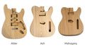 Alder, ash and mahogany guitar bodies side by side