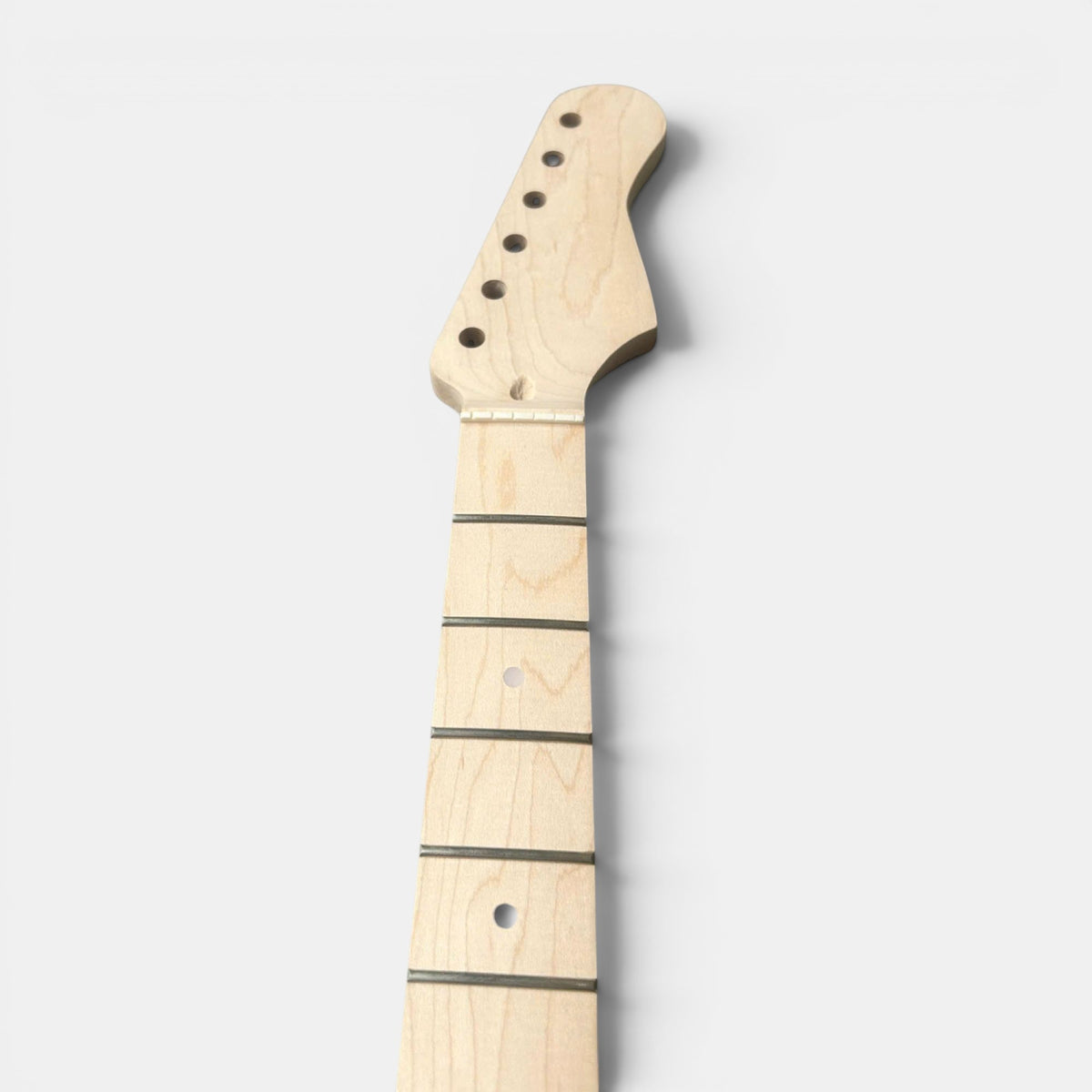close up of guitar beck maple with inlay, tuning machines heads hole and bone nut