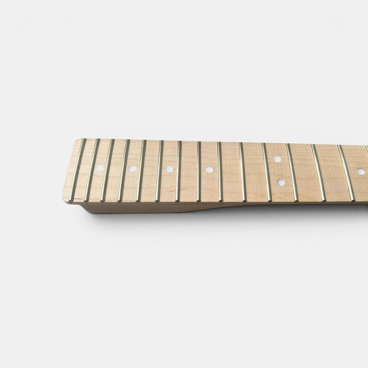 Close-up of a guitar fretboard with frets, inlay installed by The Guitar Fabrik