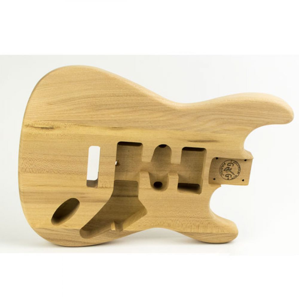 ST Ash guitar body side profile revealing carved contours and pickup routing along the natural wood grain