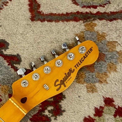 Replacement logo waterslide decal on a maple Tele-style headstock