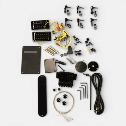 Close-up of solderless electronics including pickups, wiring harnesses, potentiometers, and bridge components for assembly