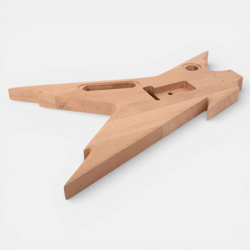 Underside three-quarter view of mahogany body displaying tremolo bridge cavity and electronics routing details
