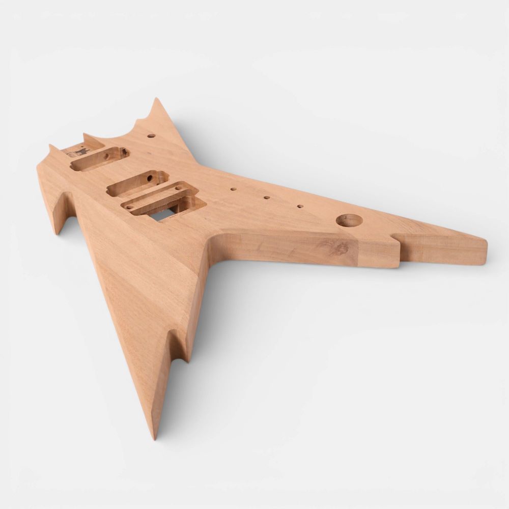Side profile of mahogany body revealing three-dimensional Razorback contours and pickup routing channels