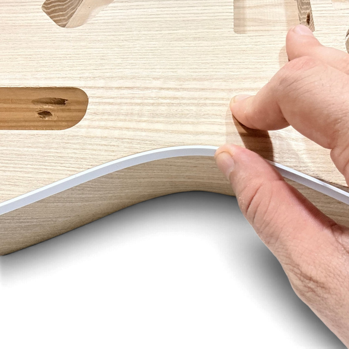 Fitting the binding strip into the channel of the body