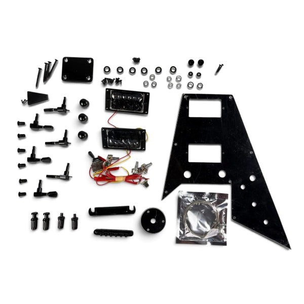 Flying V style black guitar hardware full set with pickguard, humbucker pickups, bridge, tuners and wiring flat laid