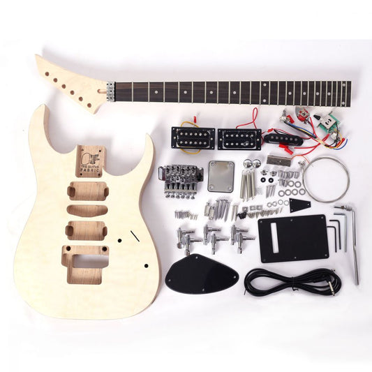 DIY Jackson Dinky kit with quilted maple top displayed flat showing unassembled body, neck, pickups, hardware and electronics