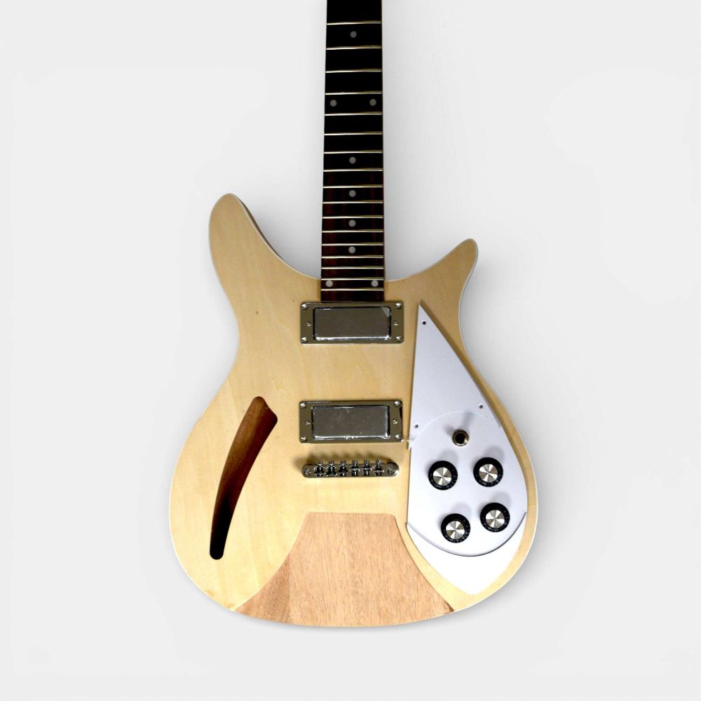 Assembled guitar front view with installed pickups, electronics, and four-knob control layout.