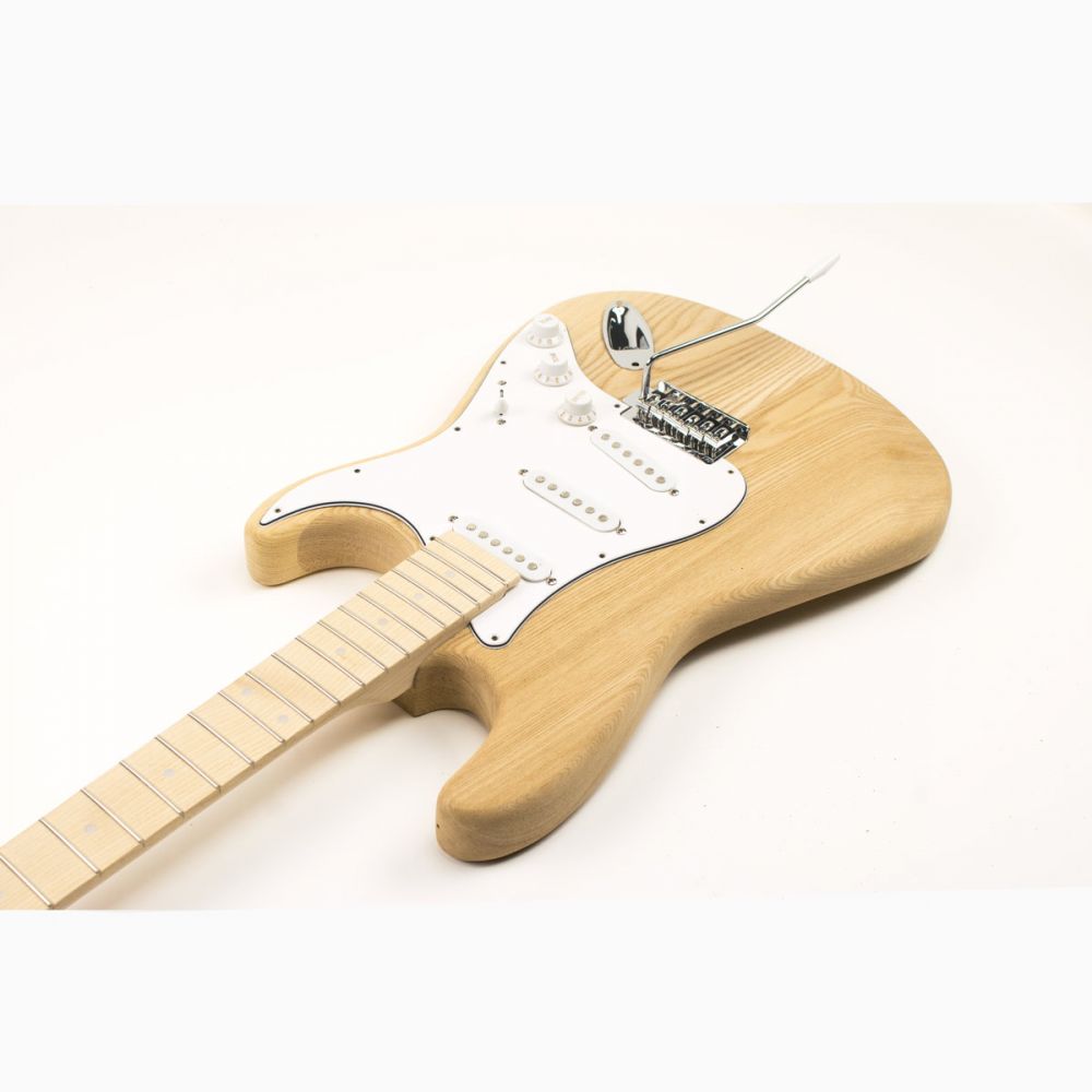 Three-quarter view of assembled ST Classic kit with white pickguard and chrome hardware installed.