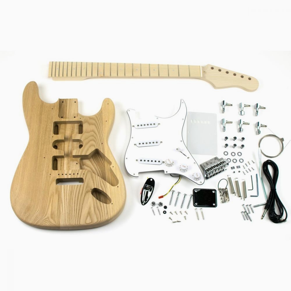 DIY ST Classic guitar kit with ash body, maple neck, and all hardware components laid flat for assembly overview.