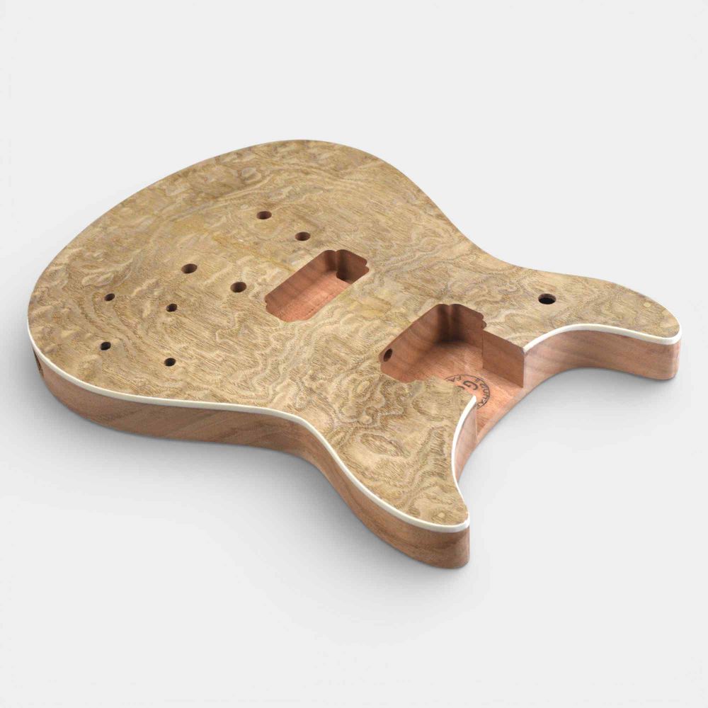 Unfinished double cut body viewed from front at angle showing contoured mahogany with ash burl top