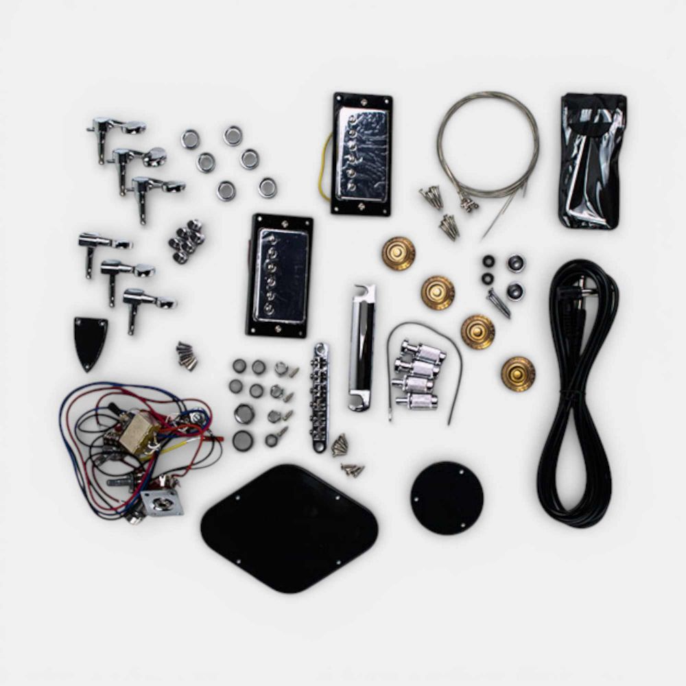 Complete hardware and electronics set for guitar kit showing pickups, tuners, bridge, and wiring