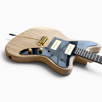 Low angle view of the assembled kit showing the gold tremolo bridge and arm, soapbar pickups and ebony fretboard