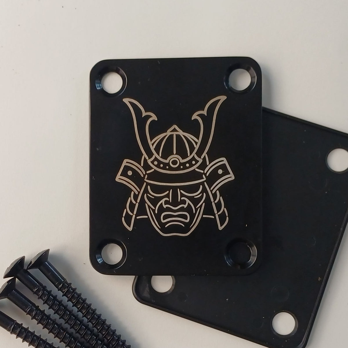Real black neck plate laser engraved with a samurai design