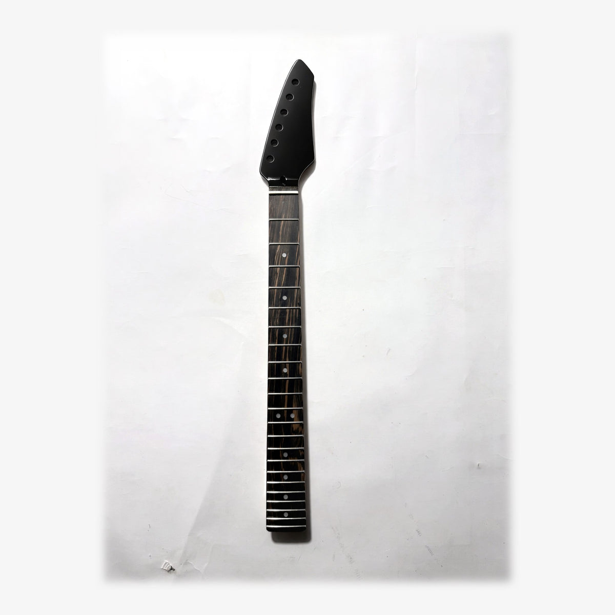 Sword headstock guitar neck in black gloss paint, front with the ebony fretboard