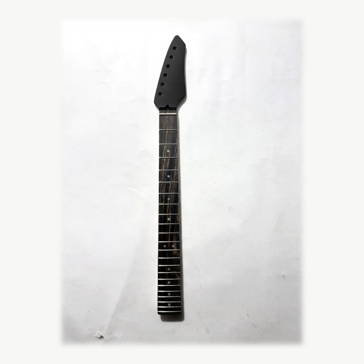 Sword headstock guitar neck in black matt paint, front with the ebony fretboard