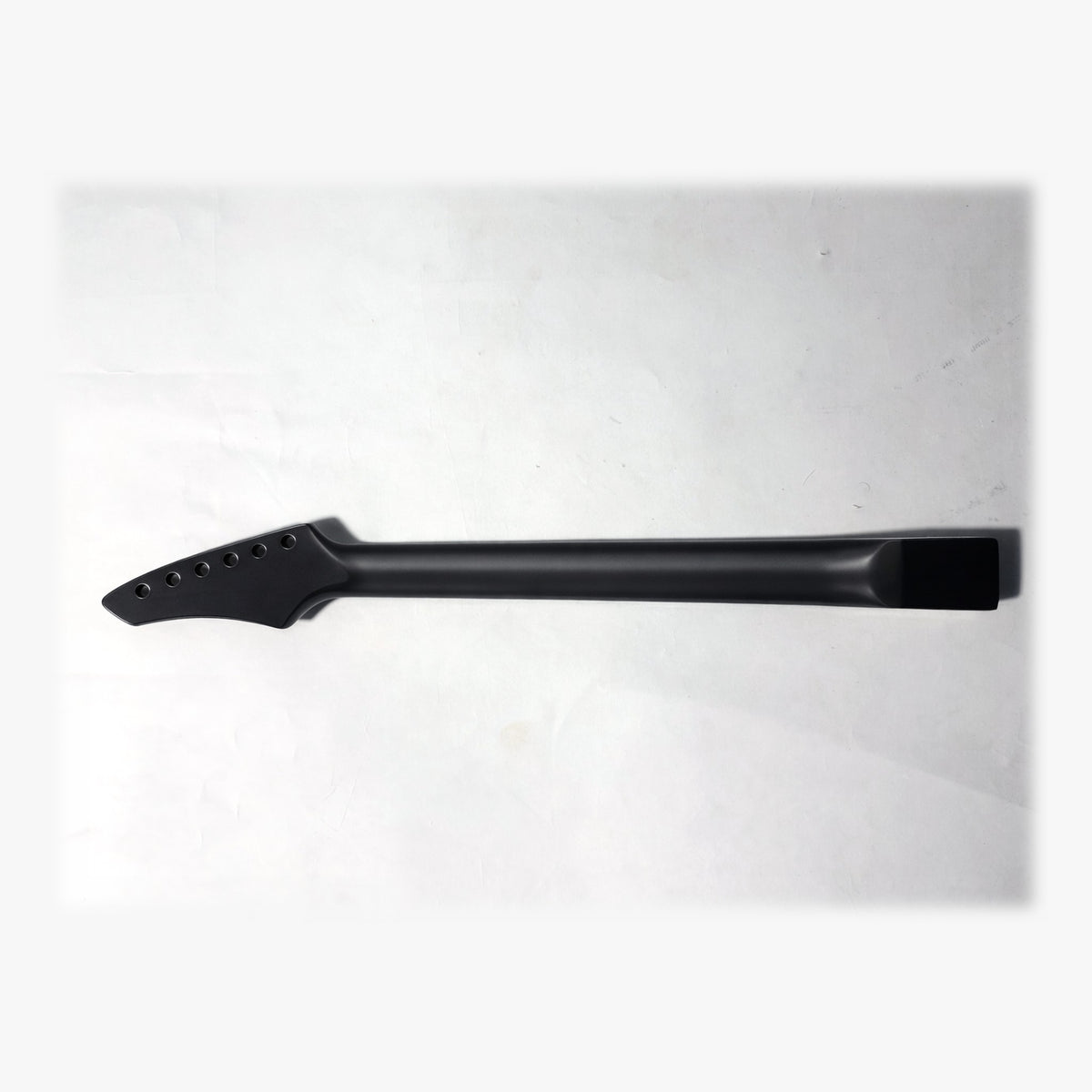 Back of the sword headstock guitar neck in black satin paint