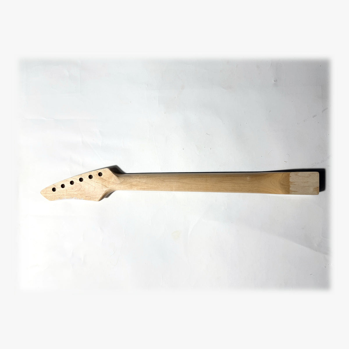 Back of the sword headstock guitar neck in clear gloss varnish