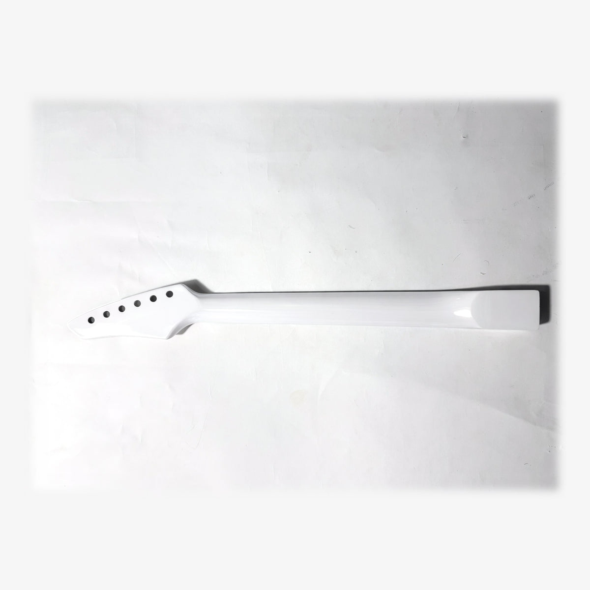 Back of the sword headstock guitar neck in white gloss paint
