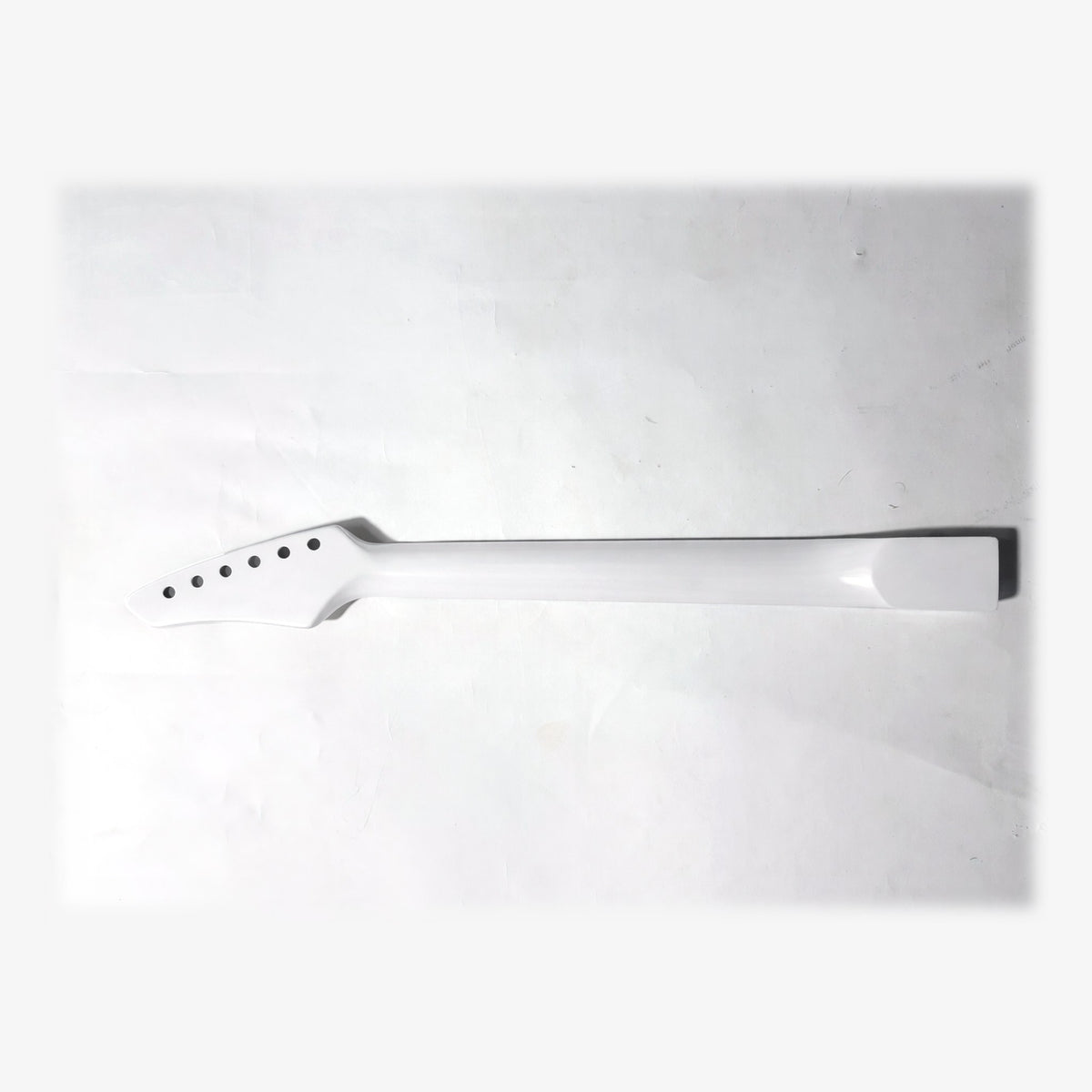 Back of the sword headstock guitar neck in white satin paint