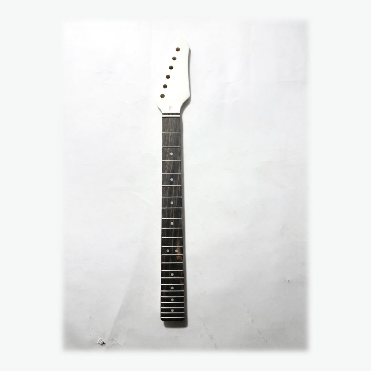 Sword headstock guitar neck in white satin paint, front with the ebony fretboard