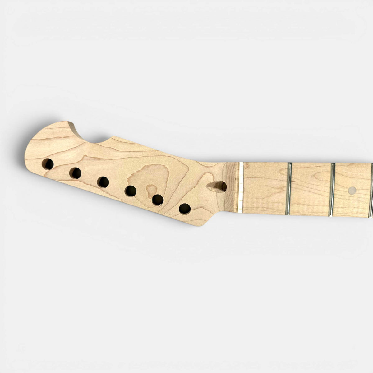 Tele maple neck side profile revealing bolt-on heel, fretboard curve, and inlay dot markers