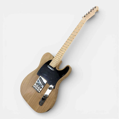 Completed TL Classic guitar angled side view showing ash body, maple neck, and all installed electronics