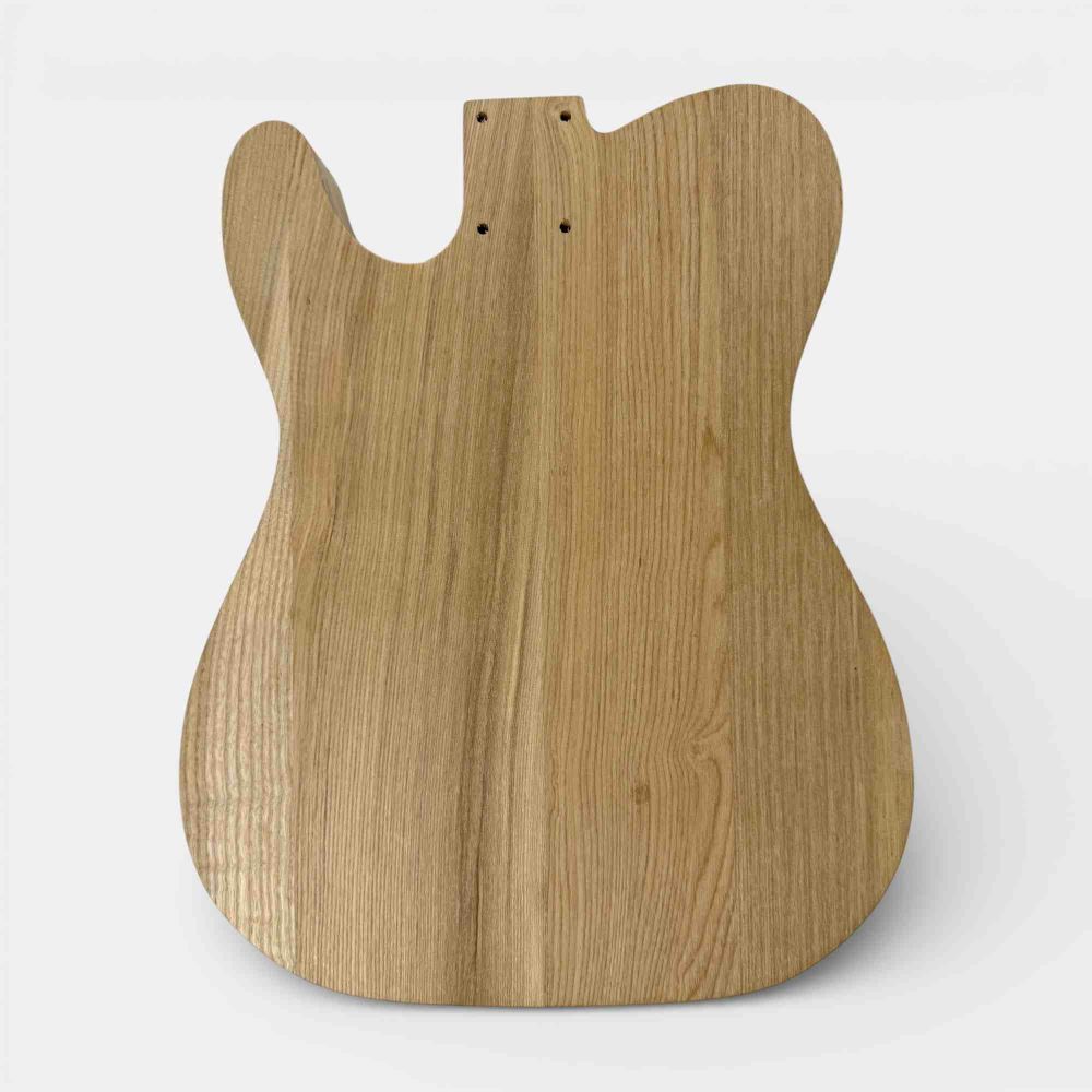 Ash body front view showing grain detail and pre-routed pickup and control cavities
