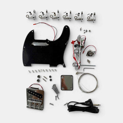 Close-up of solderless wiring electronics, black pickguard, tuning machines, and hardware components for kit assembly