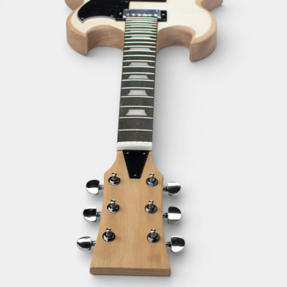 Assembled Solid-G guitar headstock-to-bridge detail showing ebony fretboard with white trapeze inlays and tuners.