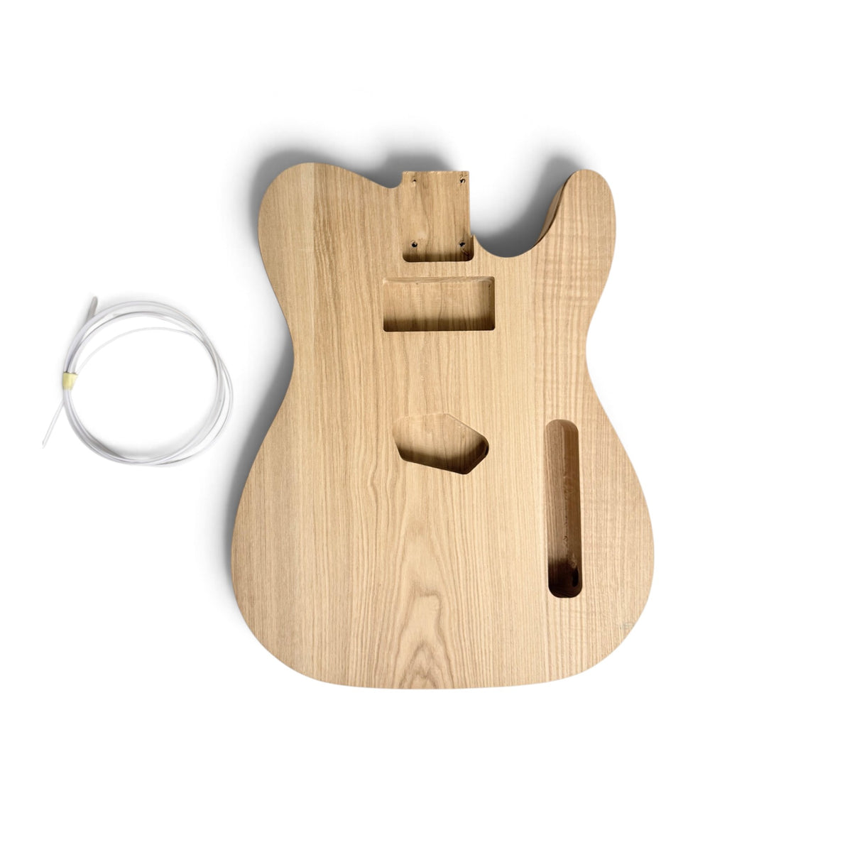 Ash TL-style guitar body routed for binding, with the binding strip