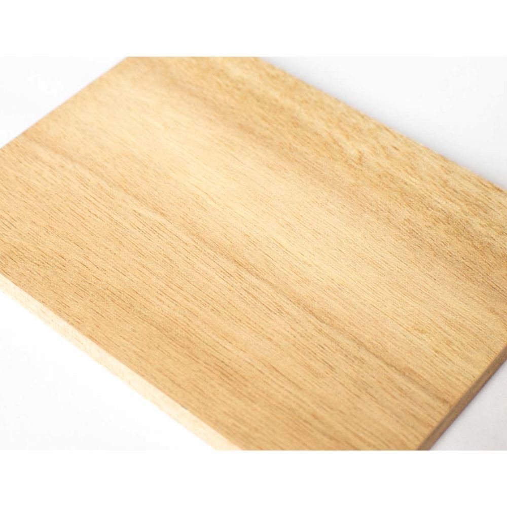 Close-up angled view of ash wood block surface showing grain detail and natural wood texture