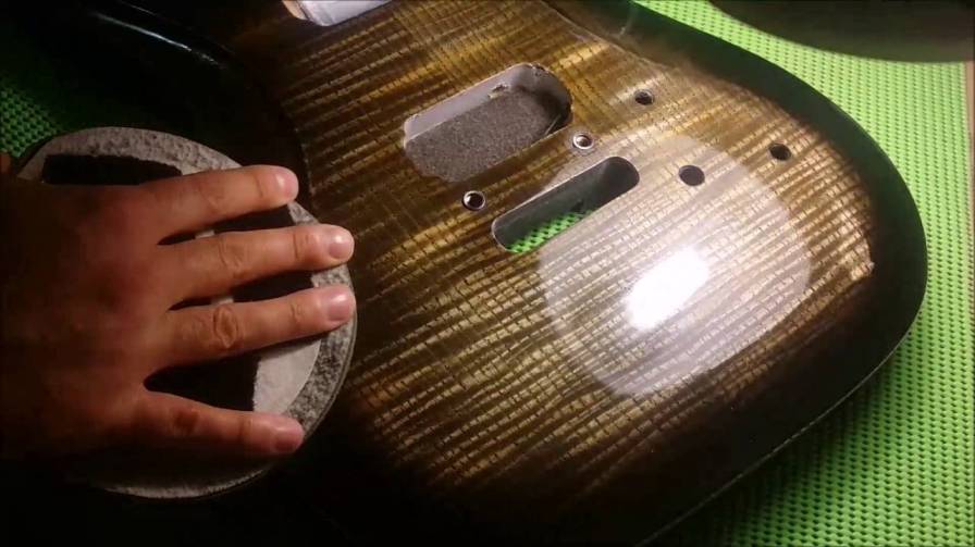 polishing a guitar